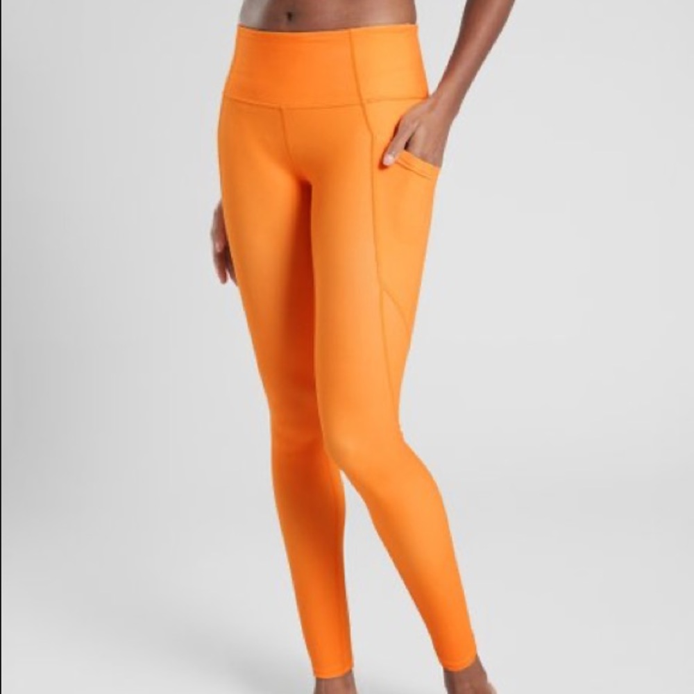 Athleta Orange Sunrise Salutation Tight